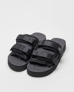 SUICOKE MOTO-PO slides with black nylon upper, black midsole and sole, strap and logo patch. From Fall/Winter 2023 collection on SUICOKE Official US & Canada Webstore. OG-056PO BLACK