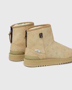 SUICOKE ELS-Mwpab-MID boots with shearling lining, beige upper, beige midsole and sole, zip closure at heel, OVO monogram debossed pattern, rubberized logo applied in white, tonal rubber trim with embossed logo at heel, antibacterial EVA footbed, and VIBRAM¬Æ arctic grip outsole. From Fall/Winter 2021 collection on SUICOKE Official US & Canada Webstore.